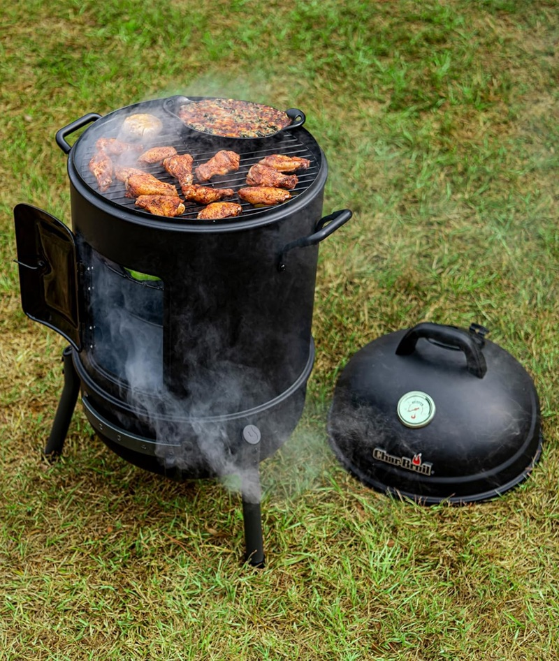 Charbroil 16 inch Bullet Smoker smoking meat on a lawn