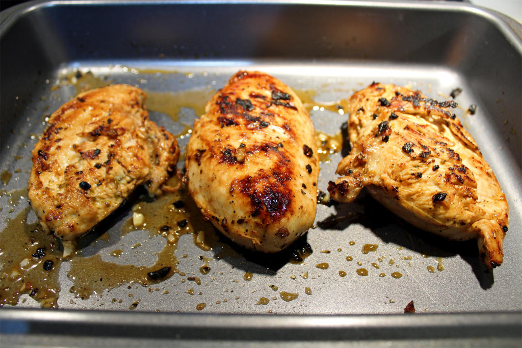 Lemon garlic chicken after being seared in a pan and before going into the oven