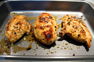 Lemon garlic chicken after being seared in a pan and before going into the oven