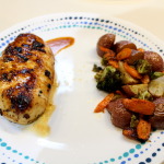 Lemon garlic chicken with roasted potatoes, carrots, and broccoli on a plate