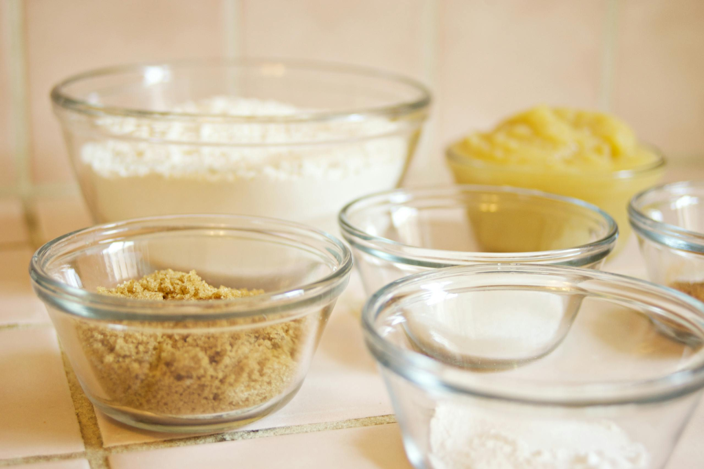 Mise en place. Assorted baking ingredients in glass bowls ready for mixing.