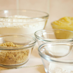 Assorted baking ingredients in glass bowls ready for mixing.