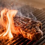 Getting a perfect sear on steak by grilling it over direct heat