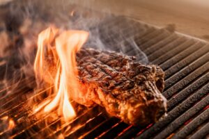 Getting a perfect sear on steak by grilling it over direct heat