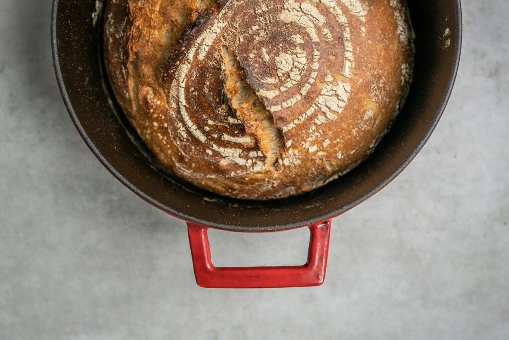 Top view of fresh baked bread in a dutch oven