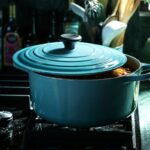 Light Blue Enameled Cast Iron Dutch Oven on a stovetop