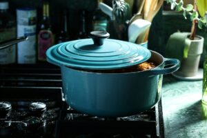 Light Blue Enameled Cast Iron Dutch Oven on a stovetop