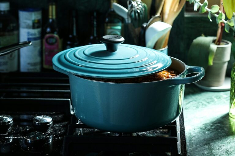 Light Blue Enameled Cast Iron Dutch Oven on a stovetop